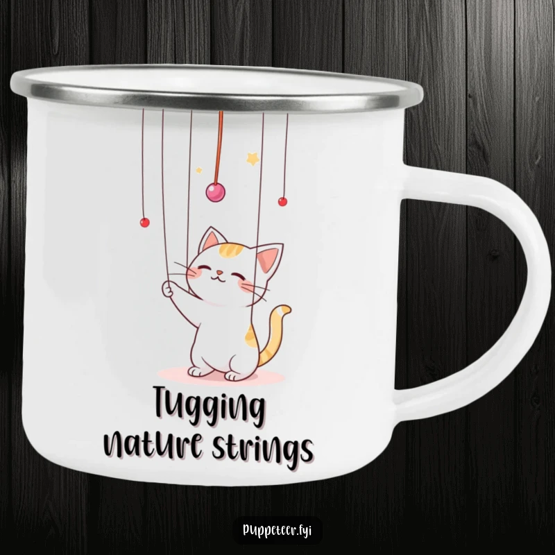 Funny Kawaii cat batting playfully at puppet strings in the air camping mug, perfect for outdoor adventures with a touch of feline puppetry humor.
