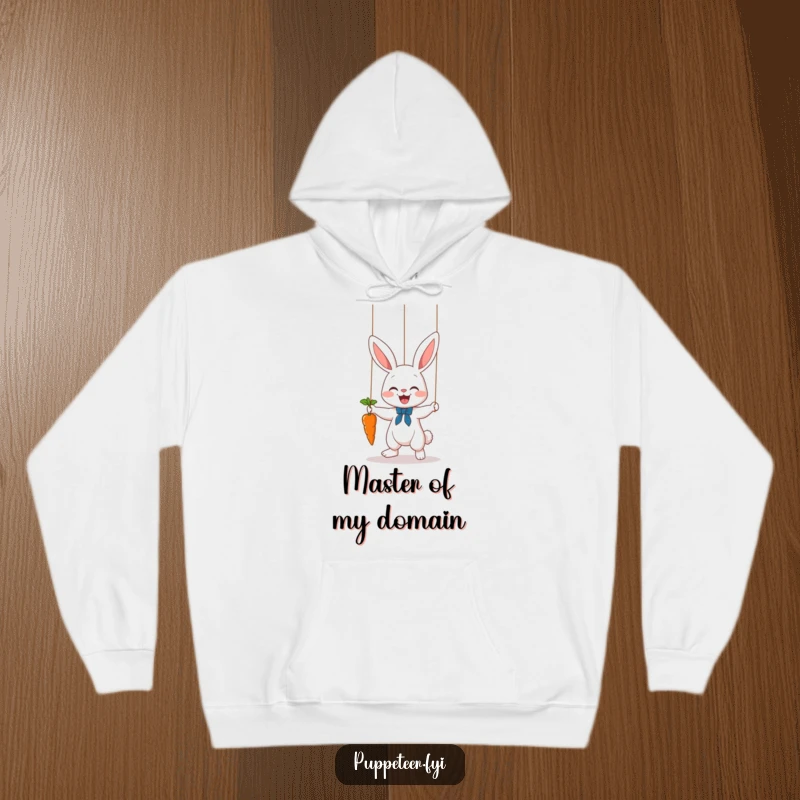 Funny bunny puppet master hoodie, depicting a cute rabbit controlling a carrot dance with strings for ultimate cozy fun.