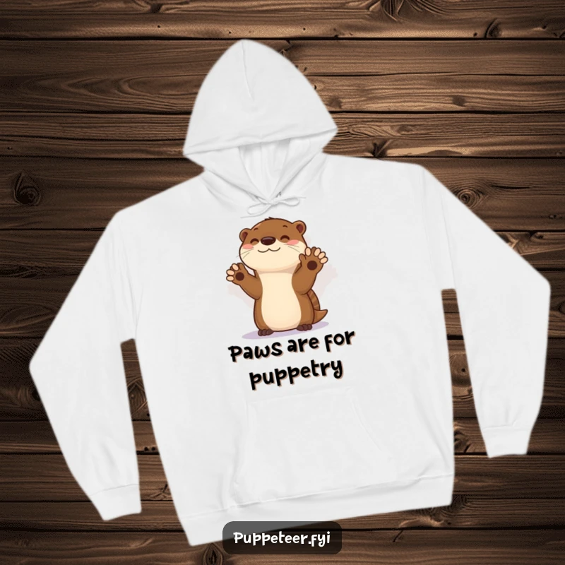 Funny hoodie depicting a skilled otter creating intricate shadow puppets, offering warmth and a touch of playful magic.