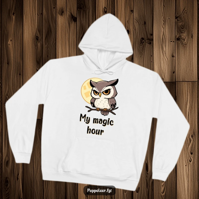 Funny Owl Hoodie featuring a sly owl with a twinkling eye, masterfully controlling a hovering moon, ideal for mystical evenings.