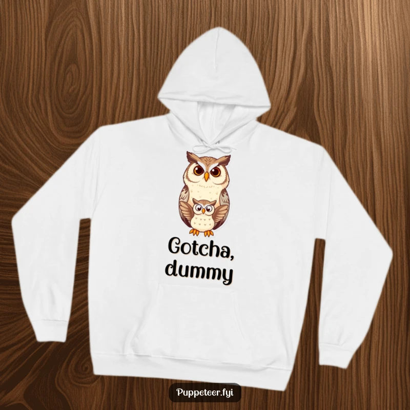Funny owl hoodie design depicting a content owl watching a small owl puppet flap, offering a humorous and cozy visual.