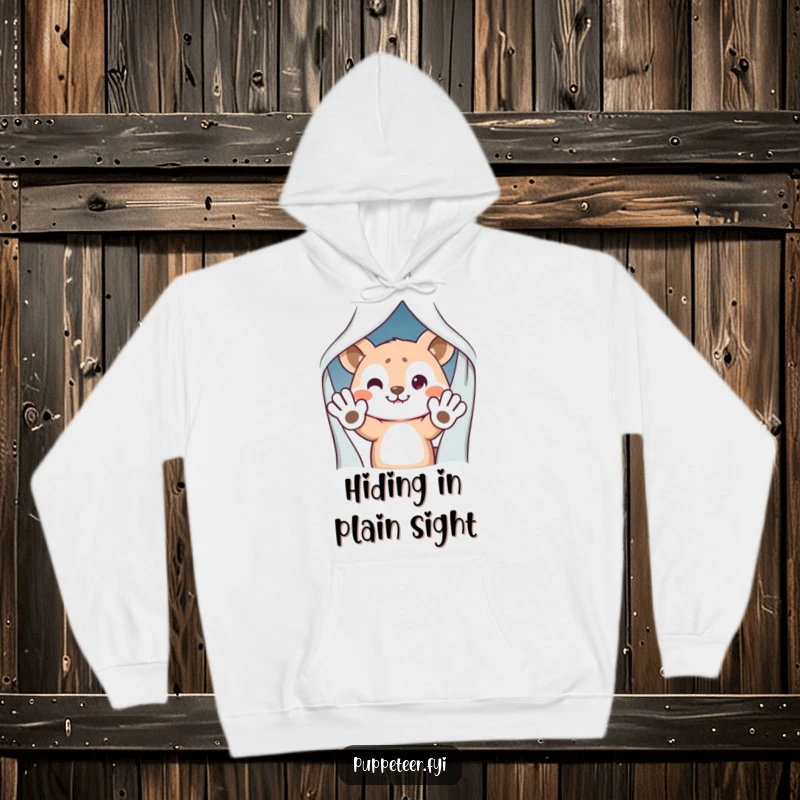 Funny Hoodie: Mischievous animal character hiding behind a curtain, waving puppet hands, a cozy and humorous design.