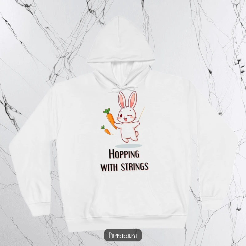 Funny hoodie of a winking rabbit puppet master making a carrot puppet dance with invisible strings, designed for comfort and playful style.