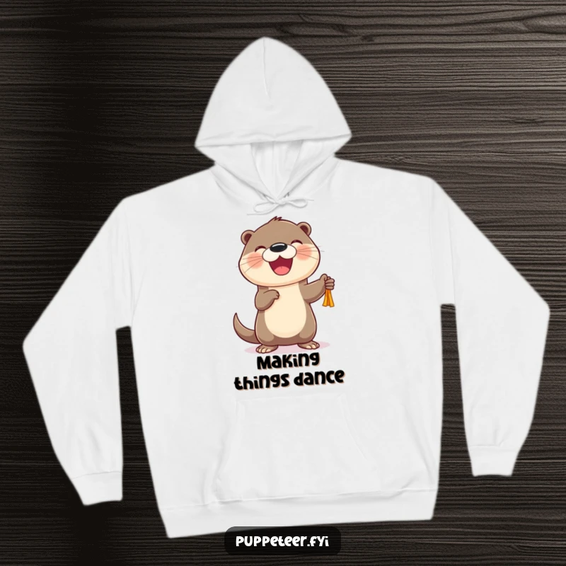 Funny Otter Puppet Dancer Hoodie featuring a cheerful otter joyfully controlling a dancing puppet, a humorous and cozy gift.