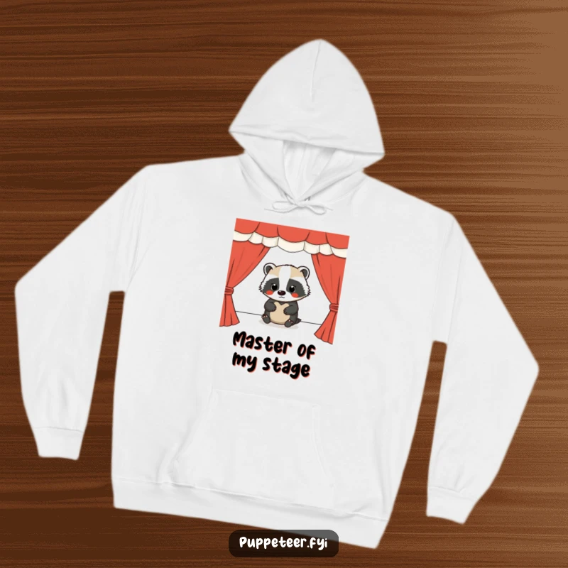 Funny hoodie with a diligent badger masterfully running a puppet show, symbolizing focus and entertainment.