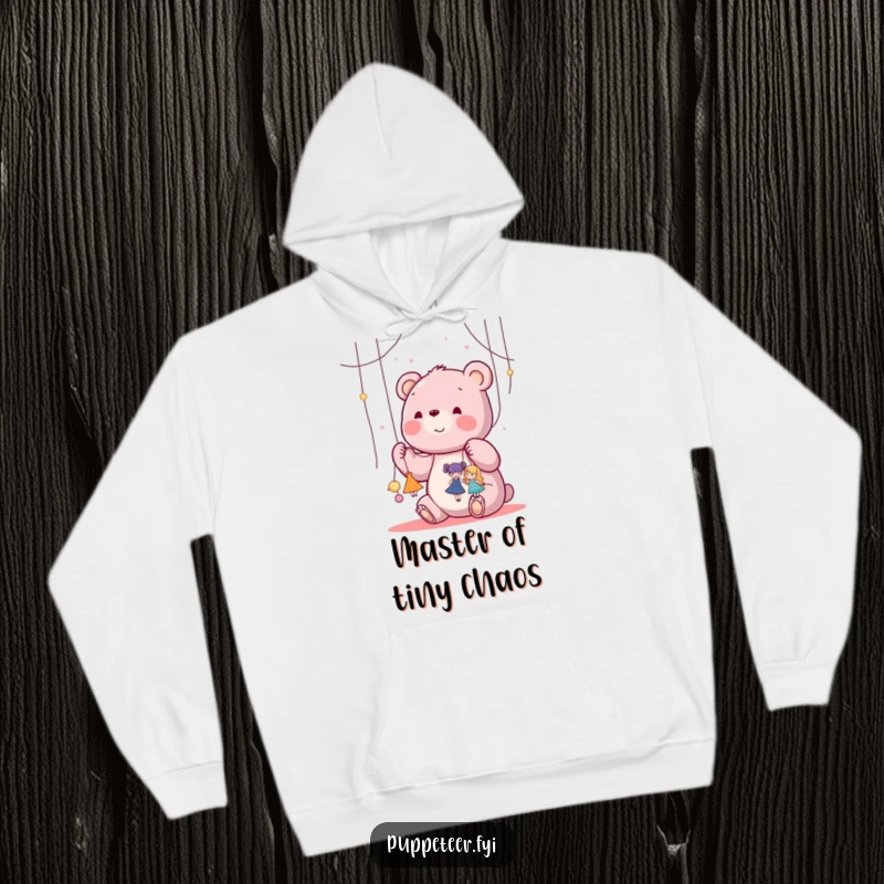 Funny kawaii bear happily manipulating strings attached to tiny dancing puppets on a comfy hoodie, perfect for a funny gift.