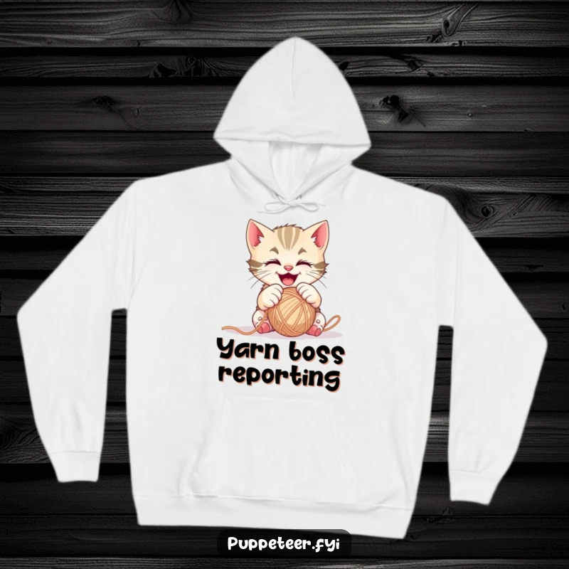 Funny mischievous kitten hoodie with gleeful paws controlling a ball of yarn, designed for ultimate comfort.