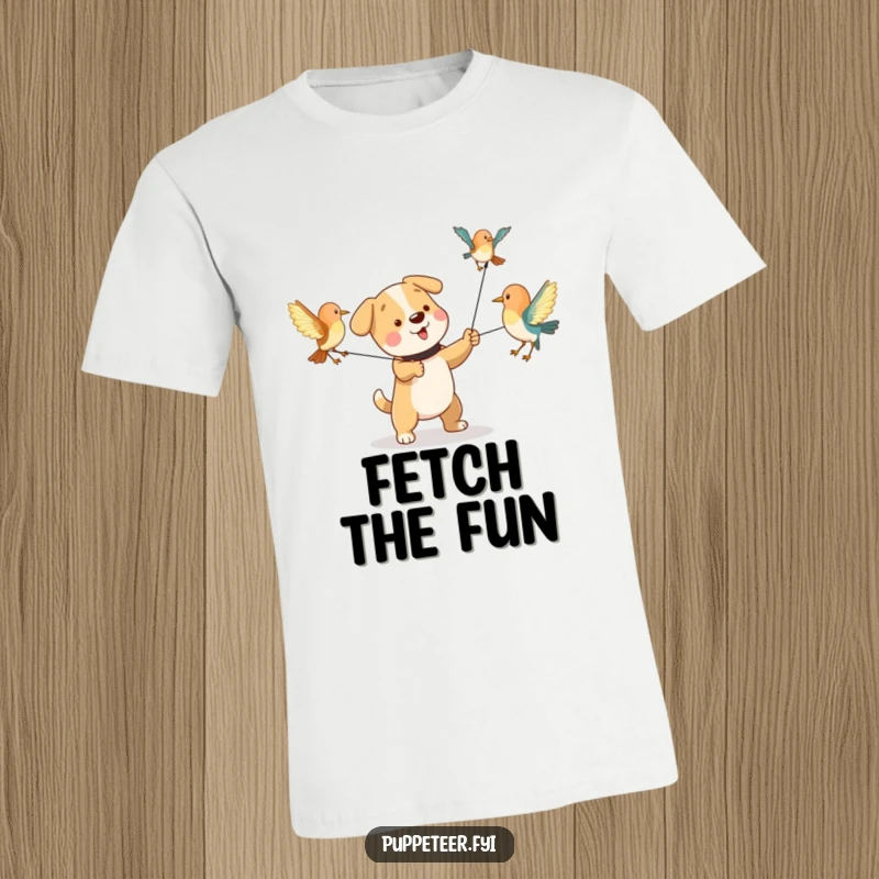 Funny t-shirt depicting a playful dog character manipulating strings to make bird puppets flap their wings, lively and humorous.