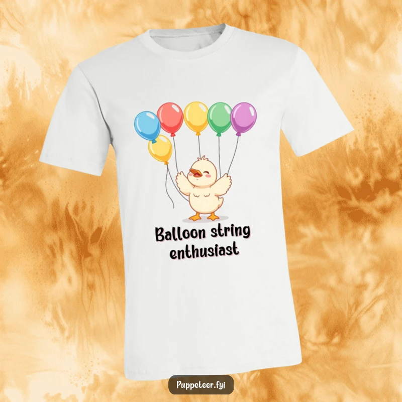Funny giggling duckling t-shirt featuring strings connected to colorful balloons, perfect for spreading cheer.