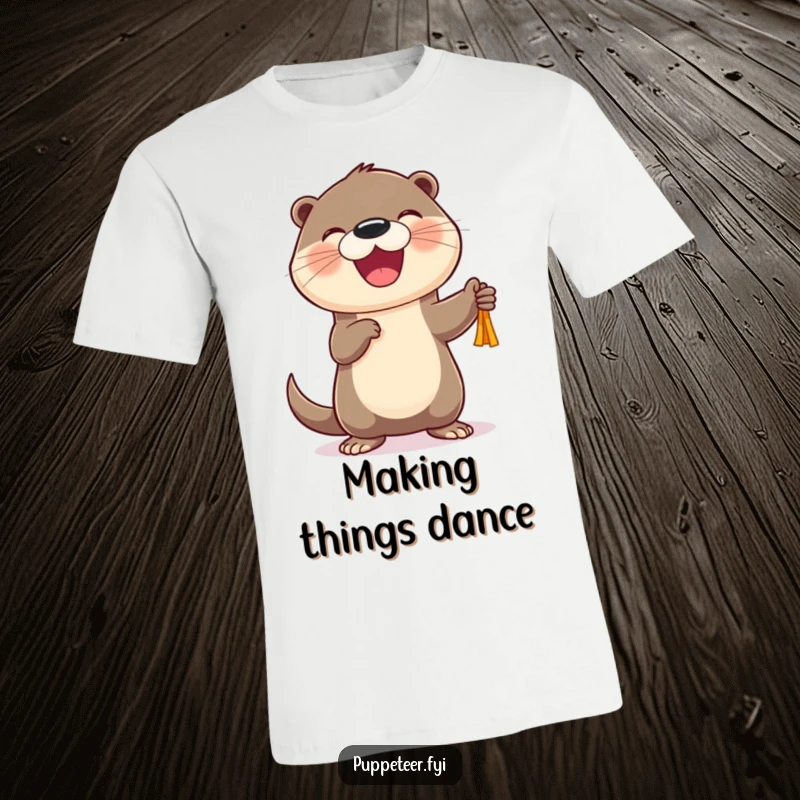 Funny Otter Puppet Dancer T-Shirt with a cheerful otter character joyfully animating a small puppet, a humorous gift.