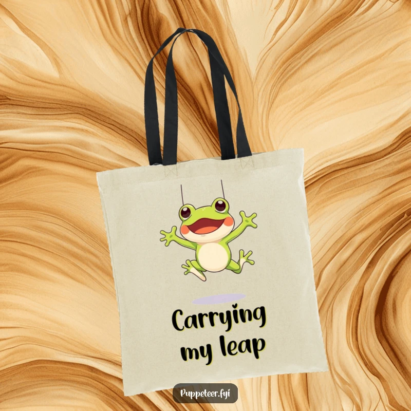 Funny tote bag with a cheerful frog character leaping and controlling a frog puppet with strings, ready for fun adventures.