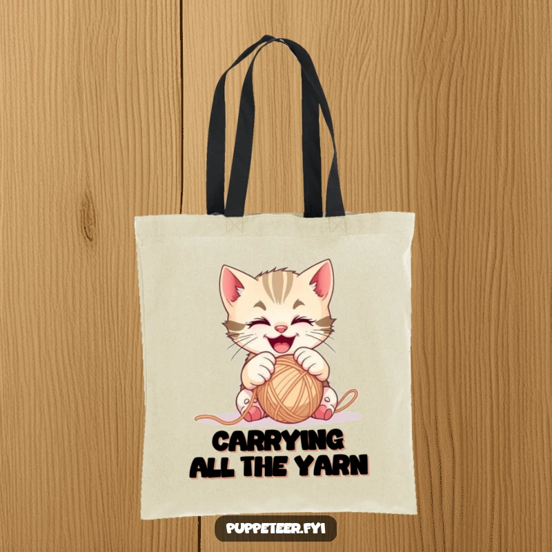 Funny mischievous kitten tote bag with gleeful paws controlling a ball of yarn, perfect for carrying everyday items.